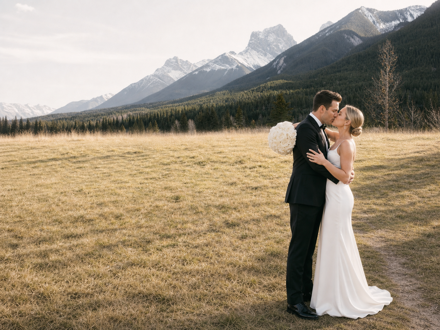Bride and groom with wedding party in the mountains
